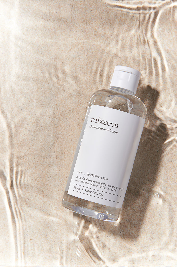 Mixsoon Galactomyces Toner 300ml bottle with label highlighting its key benefits: brightening skin tone, reducing discolorations, hydrating, and moisturizing. 