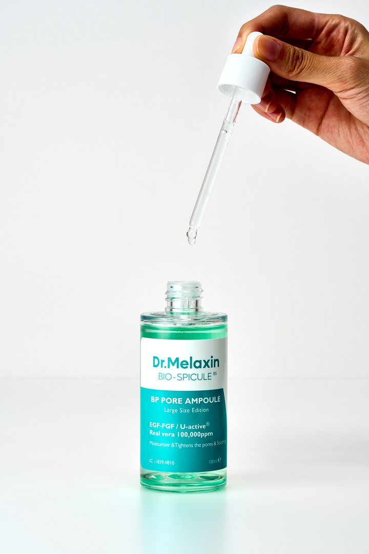 Dr. Melaxin BP Pore Ampoule 30ml bottle with dropper, designed for pore reduction and skin brightening, featuring micro needle bio-spicules technology. 