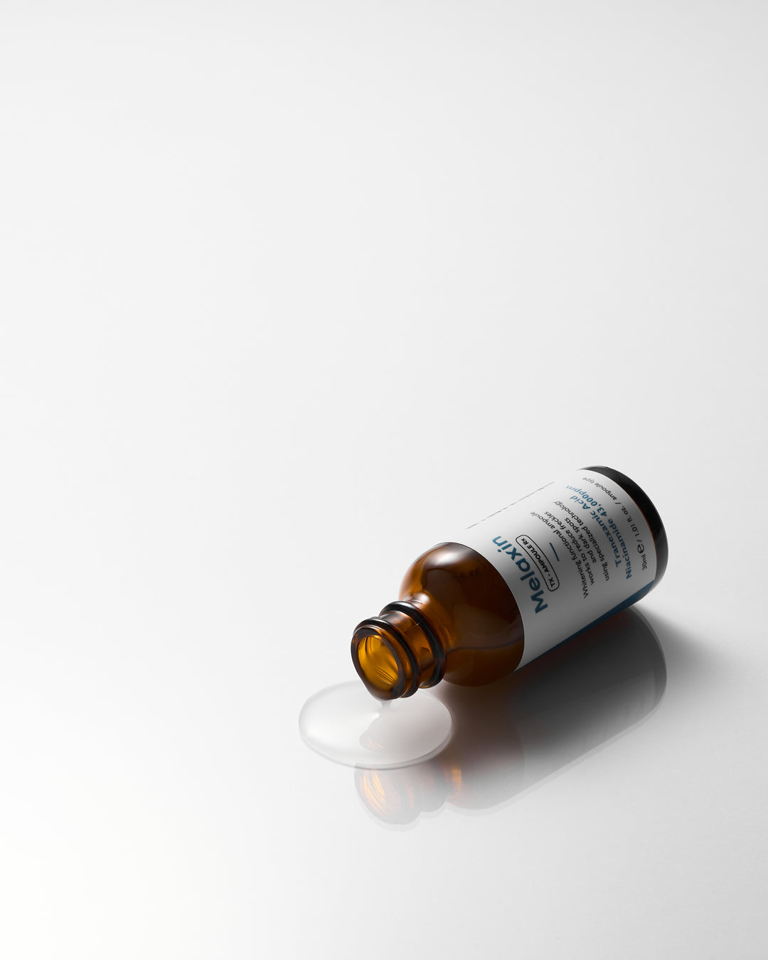 Dr.Melaxin TX Ampoule Rx 30ml - Advanced dark spot correcting serum with Tranexamic Acid and 43,000 ppm Niacinamide to reduce freckles and brighten skin tone. 