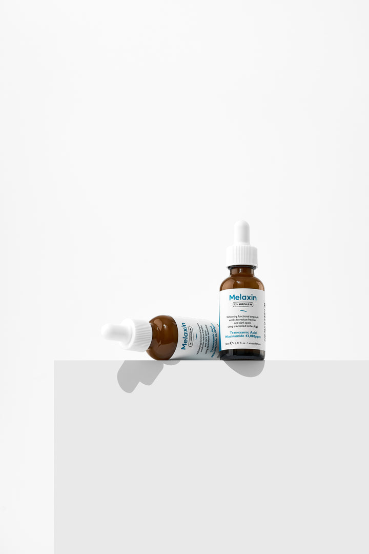 Dr.Melaxin TX Ampoule Rx 30ml - Advanced dark spot correcting serum with Tranexamic Acid and 43,000 ppm Niacinamide to reduce freckles and brighten skin tone. 