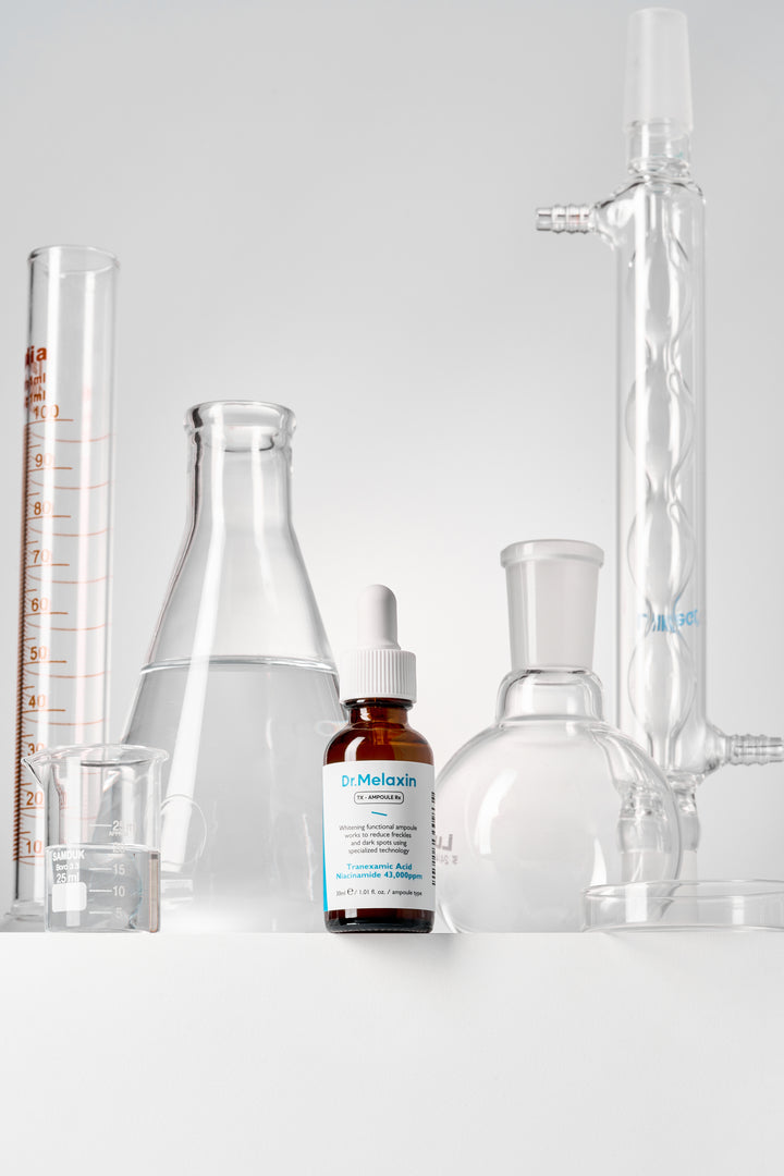 Dr.Melaxin TX Ampoule Rx 30ml - Advanced dark spot correcting serum with Tranexamic Acid and 43,000 ppm Niacinamide to reduce freckles and brighten skin tone. 