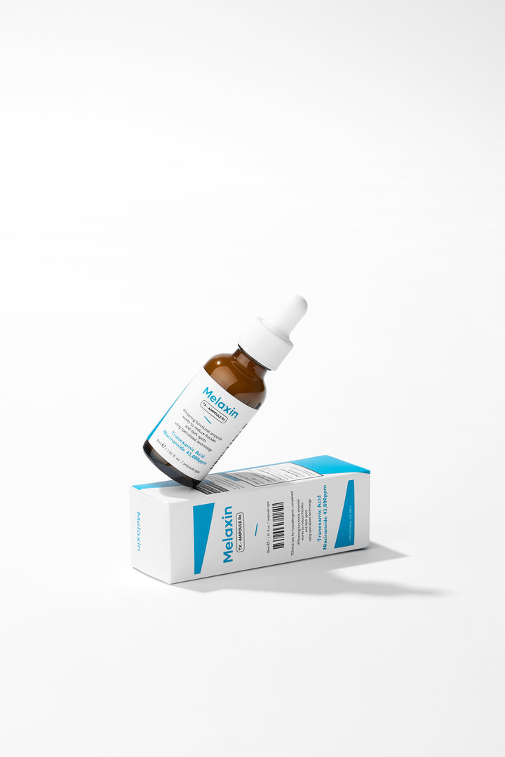 Dr.Melaxin TX Ampoule Rx 30ml - Advanced dark spot correcting serum with Tranexamic Acid and 43,000 ppm Niacinamide to reduce freckles and brighten skin tone. 