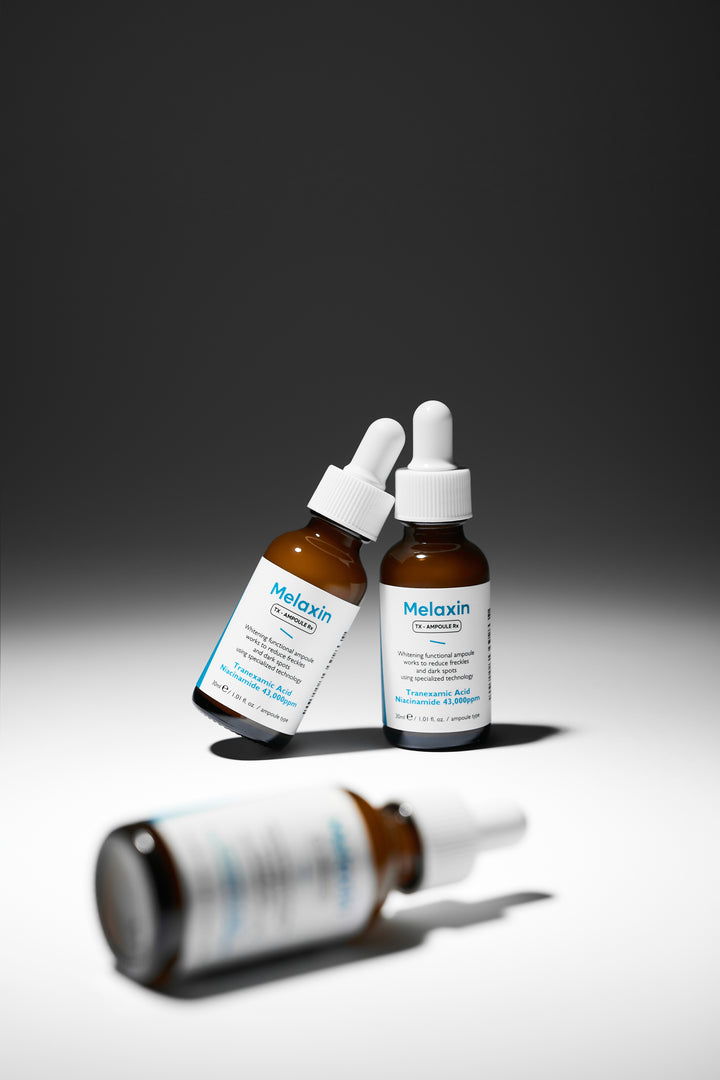 Dr.Melaxin TX Ampoule Rx 30ml - Advanced dark spot correcting serum with Tranexamic Acid and 43,000 ppm Niacinamide to reduce freckles and brighten skin tone. 