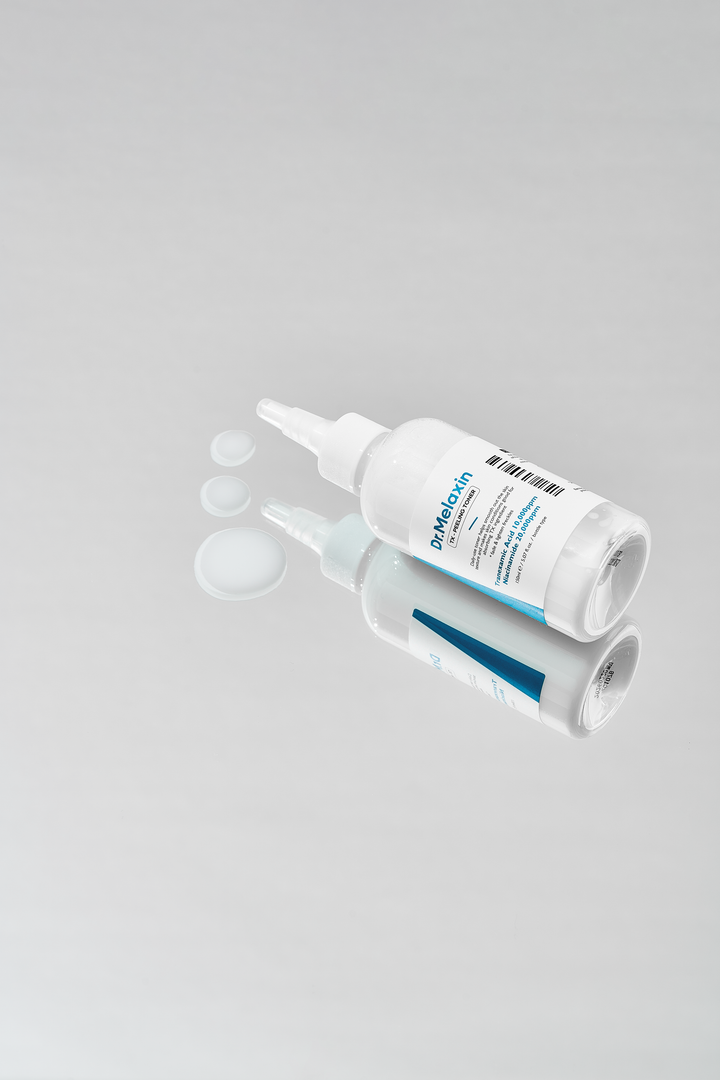 Dr.Melaxin TX Peeling Toner 150ml bottle with label highlighting key ingredients like Tranexamic Acid, Niacinamide, and Hyaluronic Acid, designed for skin brightening and gentle exfoliation. 