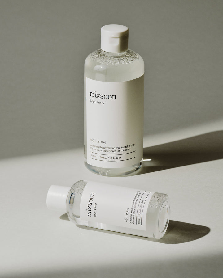 mixsoon Bean Toner 100ml bottle with soybean extract, betaine, and ginseng root ferment filtrate for soothing, hydrating, and anti-aging skincare. 