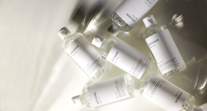 mixsoon Bean Toner 100ml bottle with soybean extract, betaine, and ginseng root ferment filtrate for soothing, hydrating, and anti-aging skincare. 